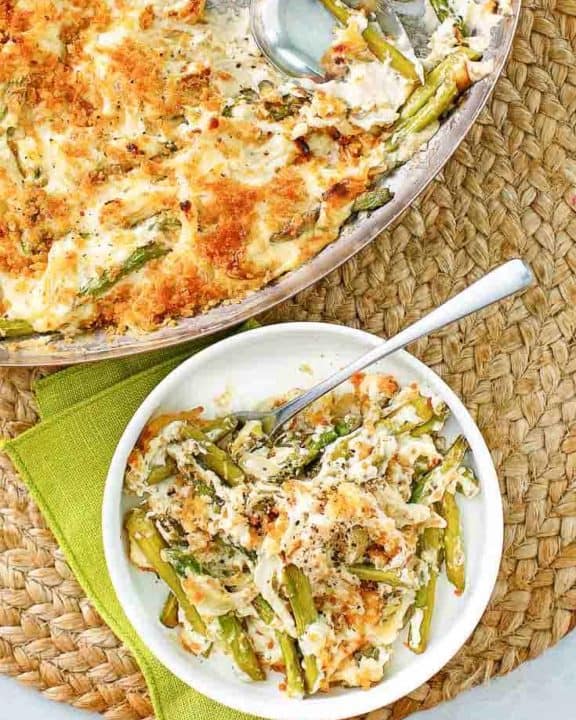 Swiss asparagus casserole in a skillet and a bowl