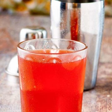 Washington Apple Cocktail in a glass with a shaker behind it