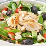 salad with grilled chicken, lettuce, berries, and feta cheese