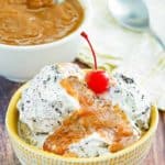 peanut butter sauce on top of ice cream in a bowl