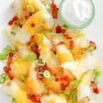 mashed potato spring rolls topped with bacon and cheese