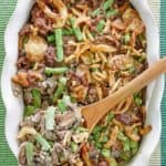 hamburger green bean casserole in a white baking dish