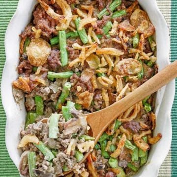 hamburger green bean casserole in a white baking dish