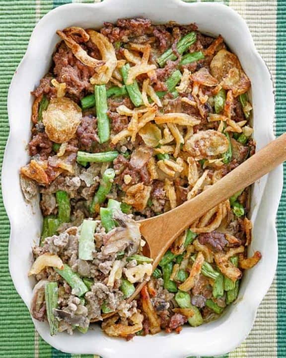 hamburger green bean casserole in a white baking dish