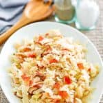 skillet cabbage with bacon on a white platter