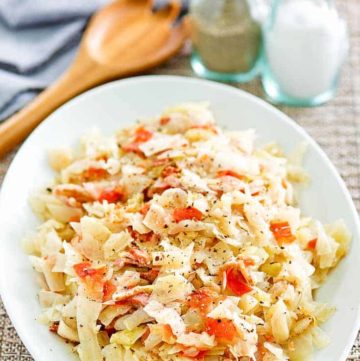 skillet cabbage with bacon on a white platter