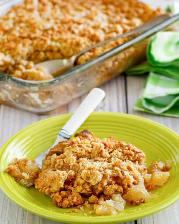 apple crisp in a baking dish and on a plate