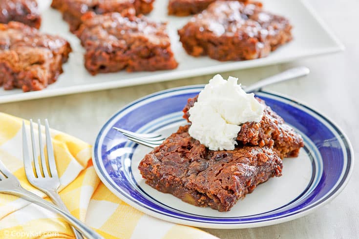 slices of chocolate pudding cake on a plate and on a platter