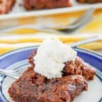 chocolate pudding cake topped with whipped cream on a plate