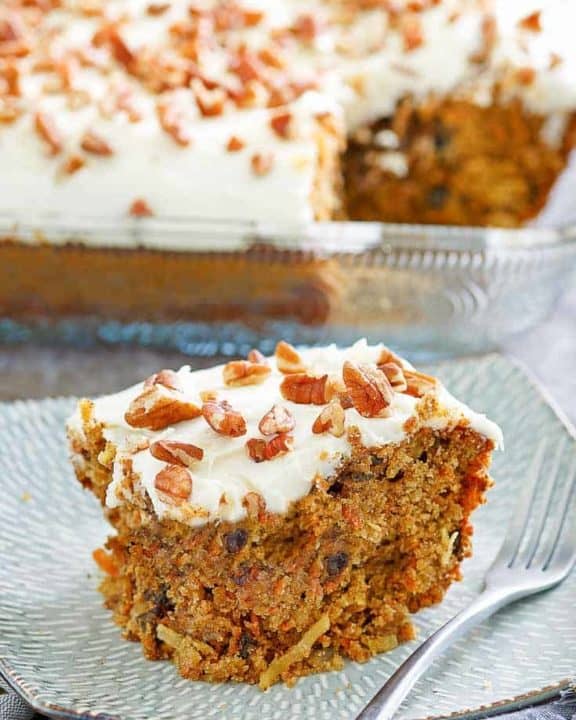 a slice of carrot cake with cream cheese frosting