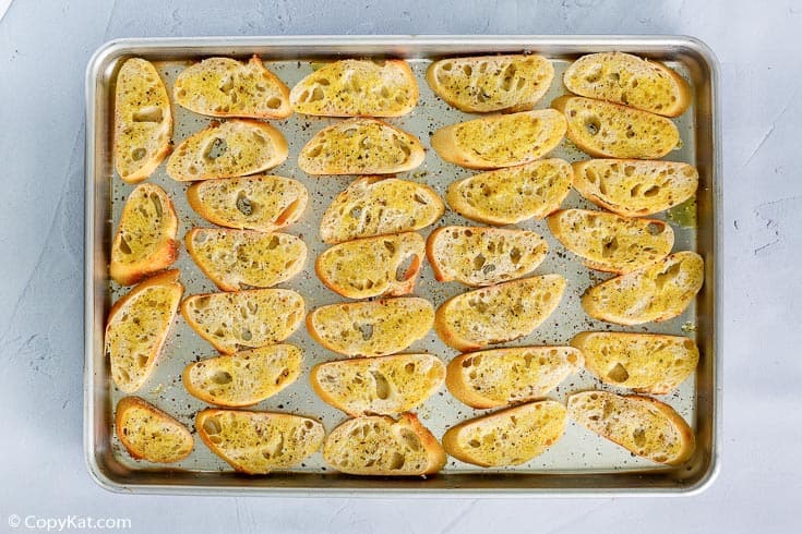 toasted crostini on a baking sheet