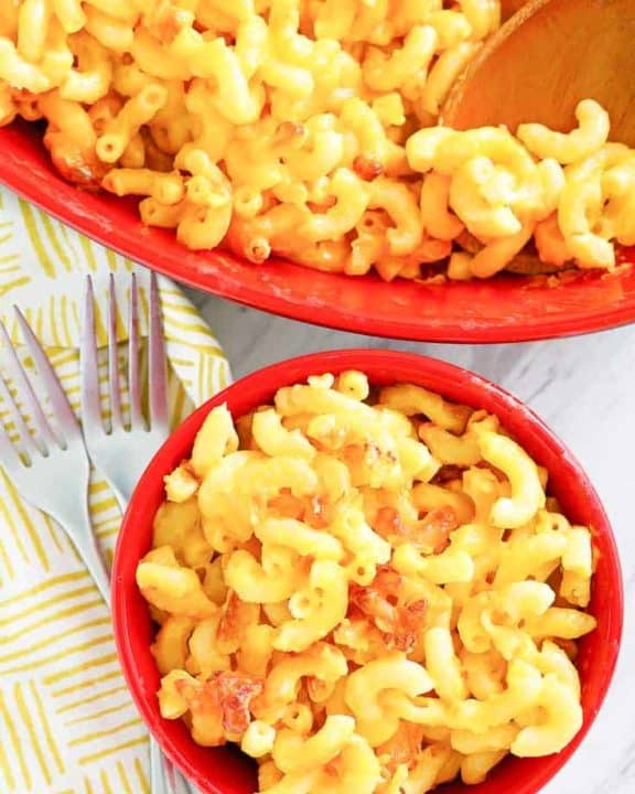 homemade Luby's macaroni and cheese in a serving dish and small bowl