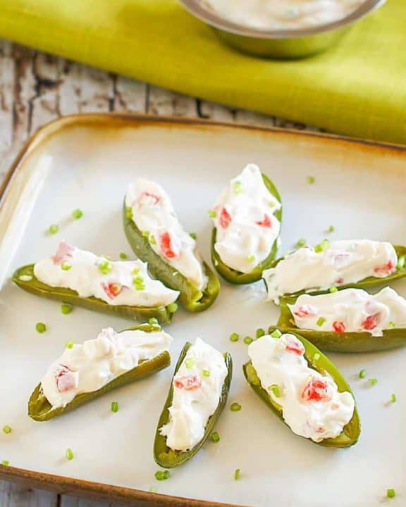 cream cheese filled fresh jalapeno peppers on a plate