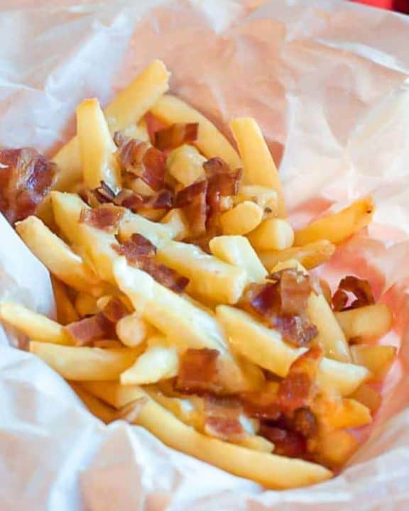 bacon fondue fries on parchment paper