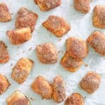 overhead view of cinnamon sugar pretzel bites on parchment paper