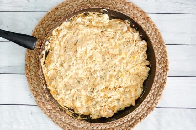 cream cheese chicken enchiladas filling mixture in a skillet