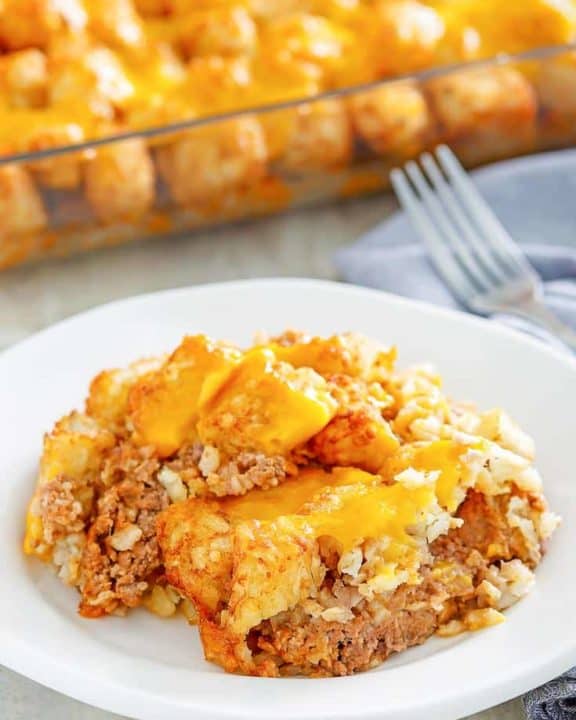 a serving of hamburger tater tot casserole on a white plate