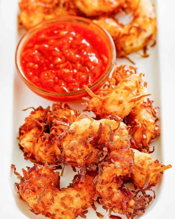 Homemade Joes Coconut Shrimp and dipping sauce on a platter
