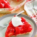 a slice of homemade Big Boy strawberry pie with a dollop of whipped cream on top
