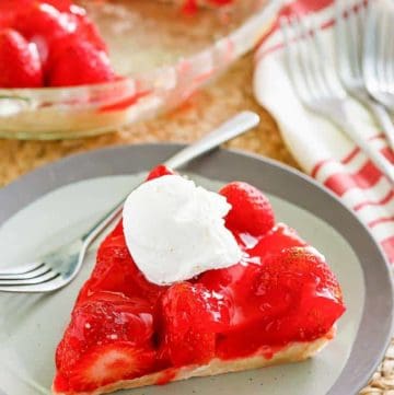 a slice of homemade Big Boy strawberry pie with a dollop of whipped cream on top
