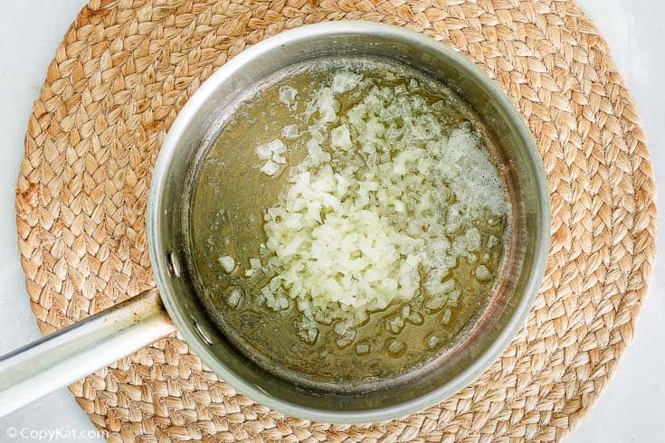 melted butter and diced onions in a pan