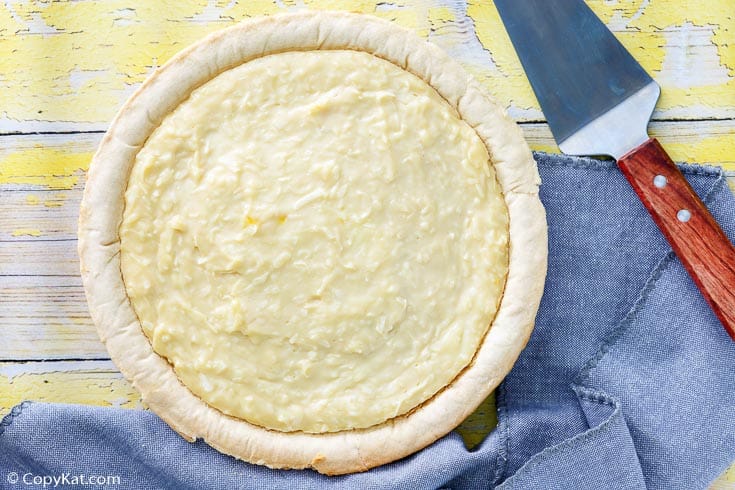 overhead view of a whole coconut cream pie