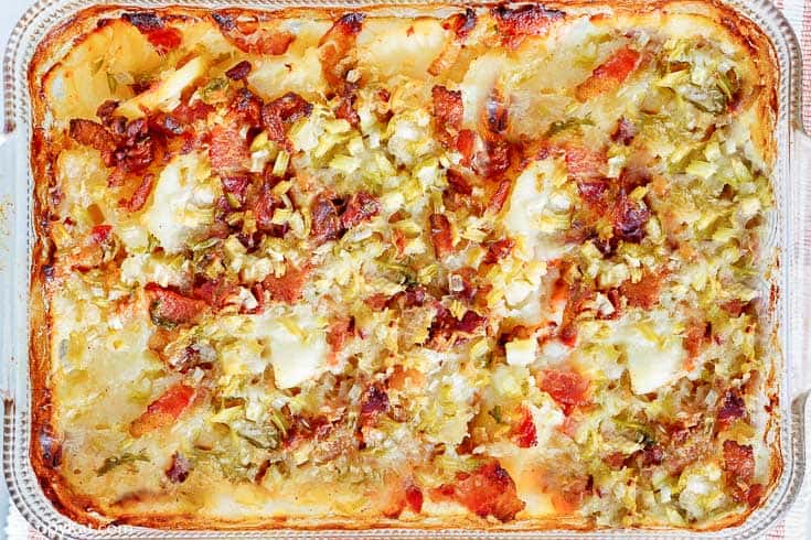 Hot German potato salad in a glass baking dish