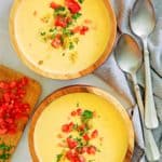 overhead view of two bowls of Canadian cheese soup