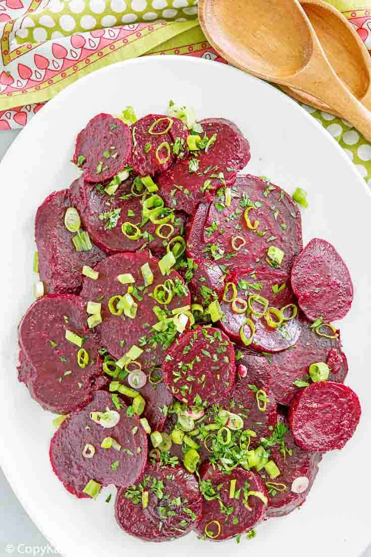 overhead view of marinated beet salad on a platter