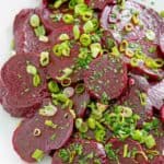 marinated beet salad on a white platter