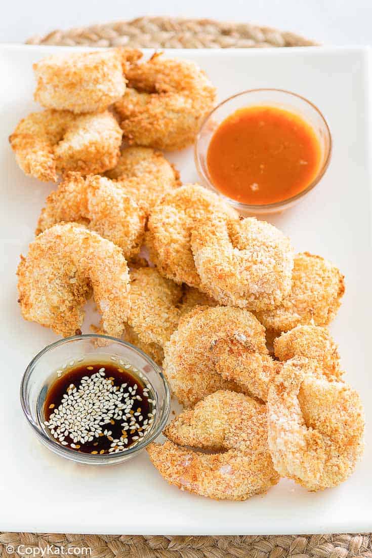 air fryer shrimp tempura on a platter with dipping sauces