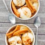 overhead view of two bowl of bananas foster dessert