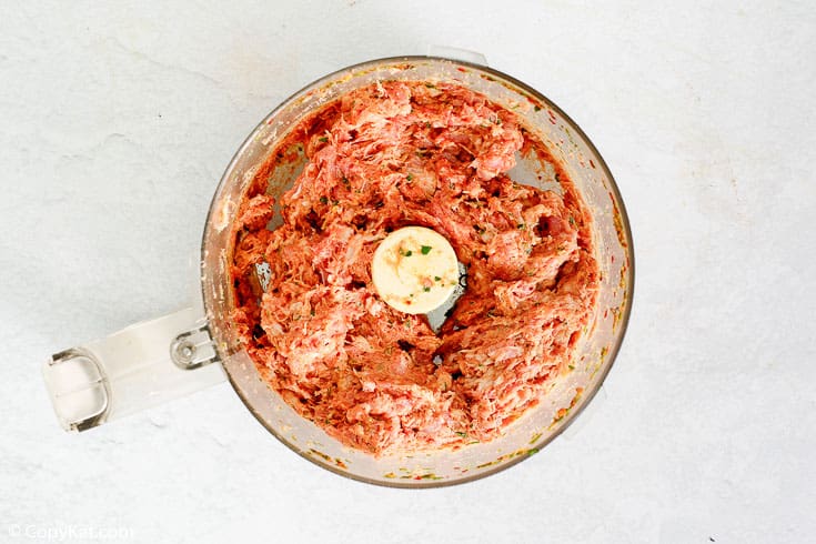 ground homemade Italian sausage in a food processor bowl
