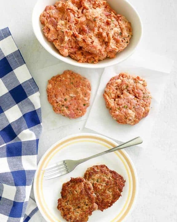 overhead view of homemade Italian sausage in a bowl and patties