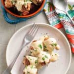 overhead view of homemade Ikea Swedish meatballs and gravy on a plate and in a bowl