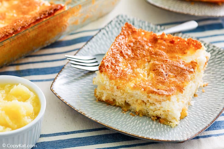 a slice of pineapple angel food cake and a fork on a plate