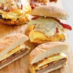 three homemade Wendy's Breakfast Baconator sandwiches and bacon slices