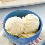 the scoops of cake batter ice cream in a blue bowl