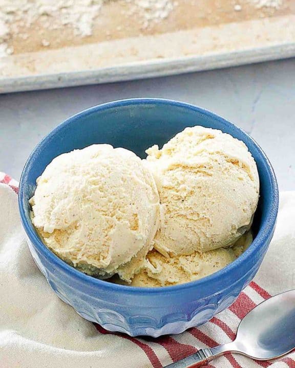 the scoops of cake batter ice cream in a blue bowl