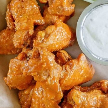 chicken wings covered in homemade Hooters wing sauce