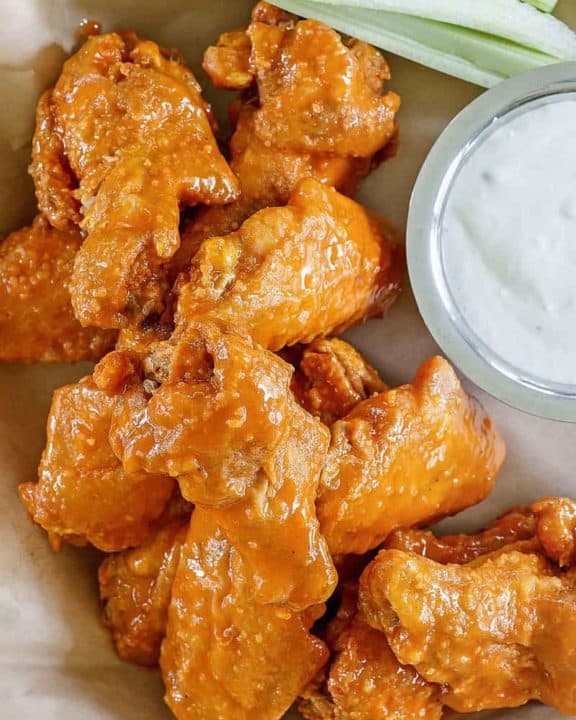 chicken wings covered in homemade Hooters wing sauce