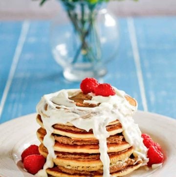 a stack of homemade IHOP Cinnastack pancakes with cream cheese icing