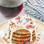 funfetti pancakes with icing and syrup