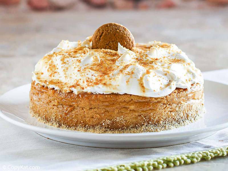 a pumpkin pie cheesecake topped with whipped cream