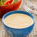 a bowl of homemade Russian dressing and a salad