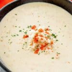a bowl of she crab soup with crabmeat and crab roe