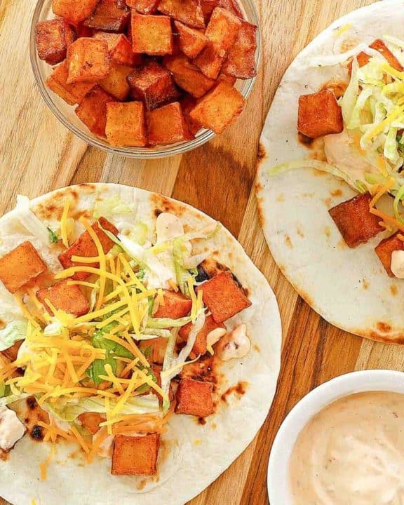 Homemade Taco Bell Spicy Potato Taco, chipotle sauce, and spicy fried potatoes