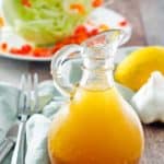 homemade Brown Derby French Dressing in front of a wedge salad