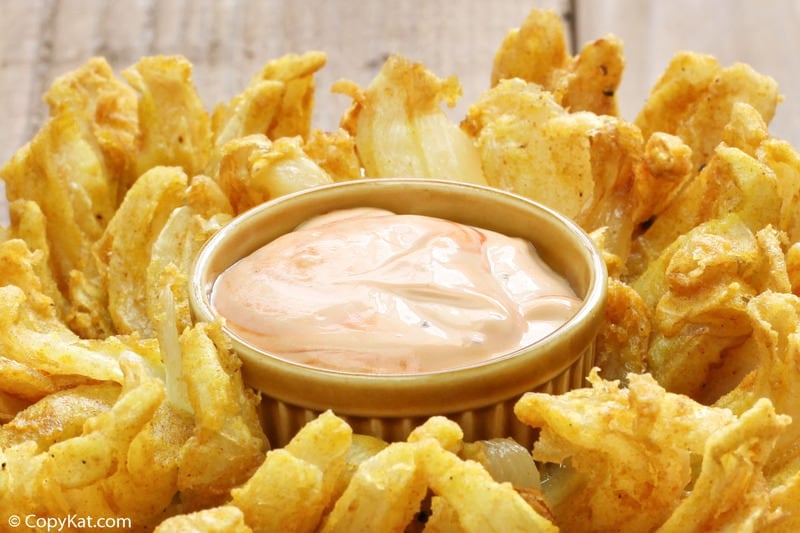 a bowl of homemade Chili's Awesome Blossom Dipping Sauce in a blooming onion