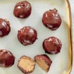 chocolate covered peanut butter balls on a plate